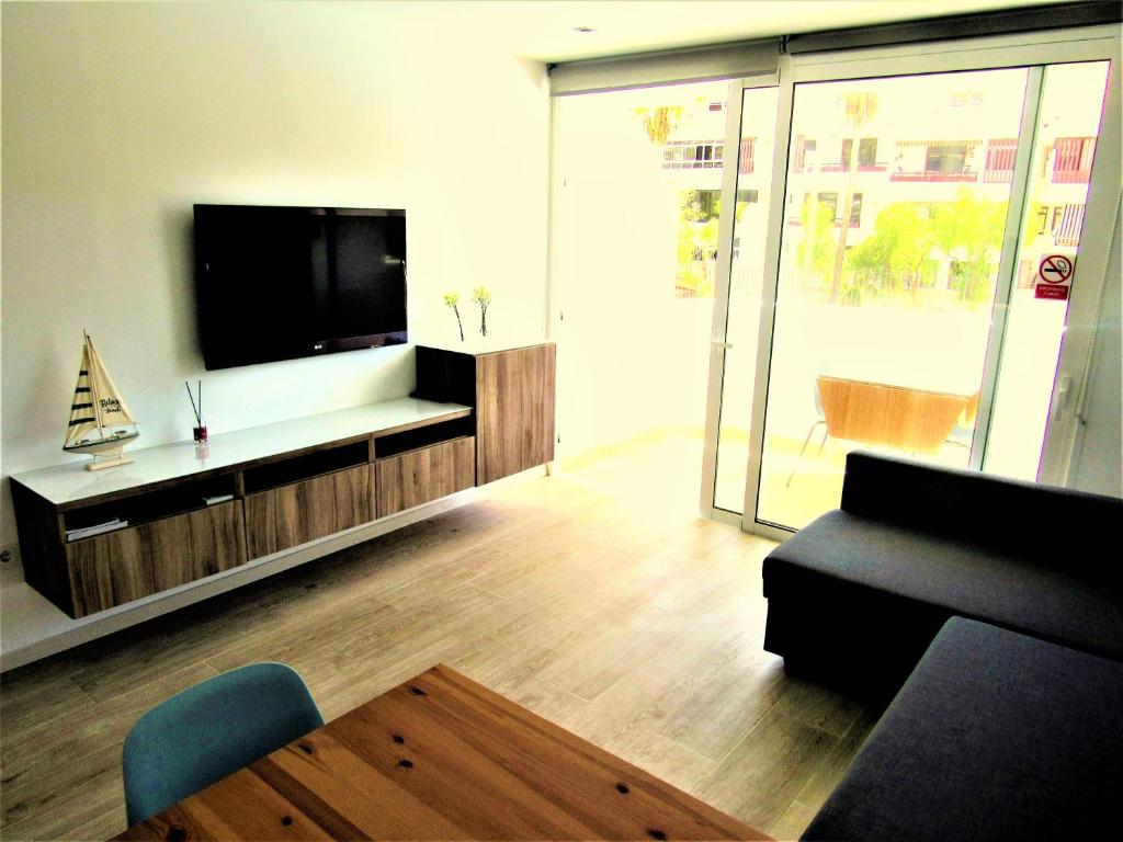 Spotless south facing apartment with pool view and WIFI heart of Las Americas