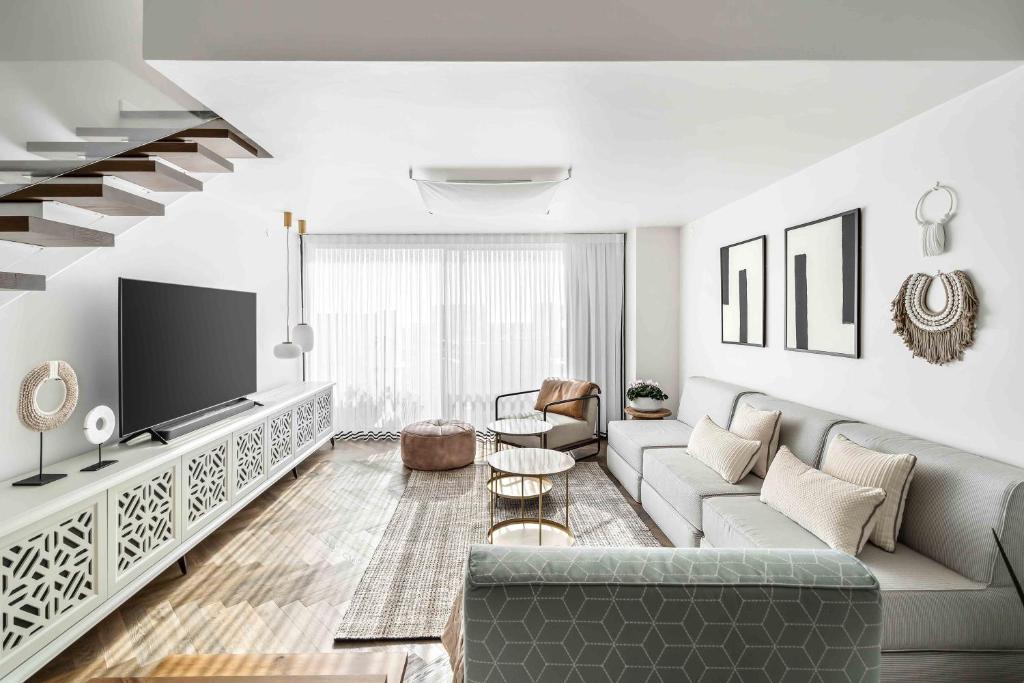 Elegant Beachfront Duplex with Private Parking